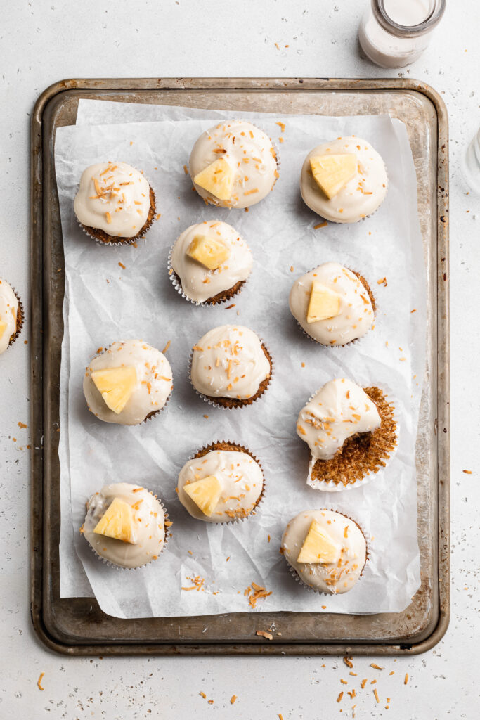 overhead image of almond flour hummingbird cupcakes on a baking sheet