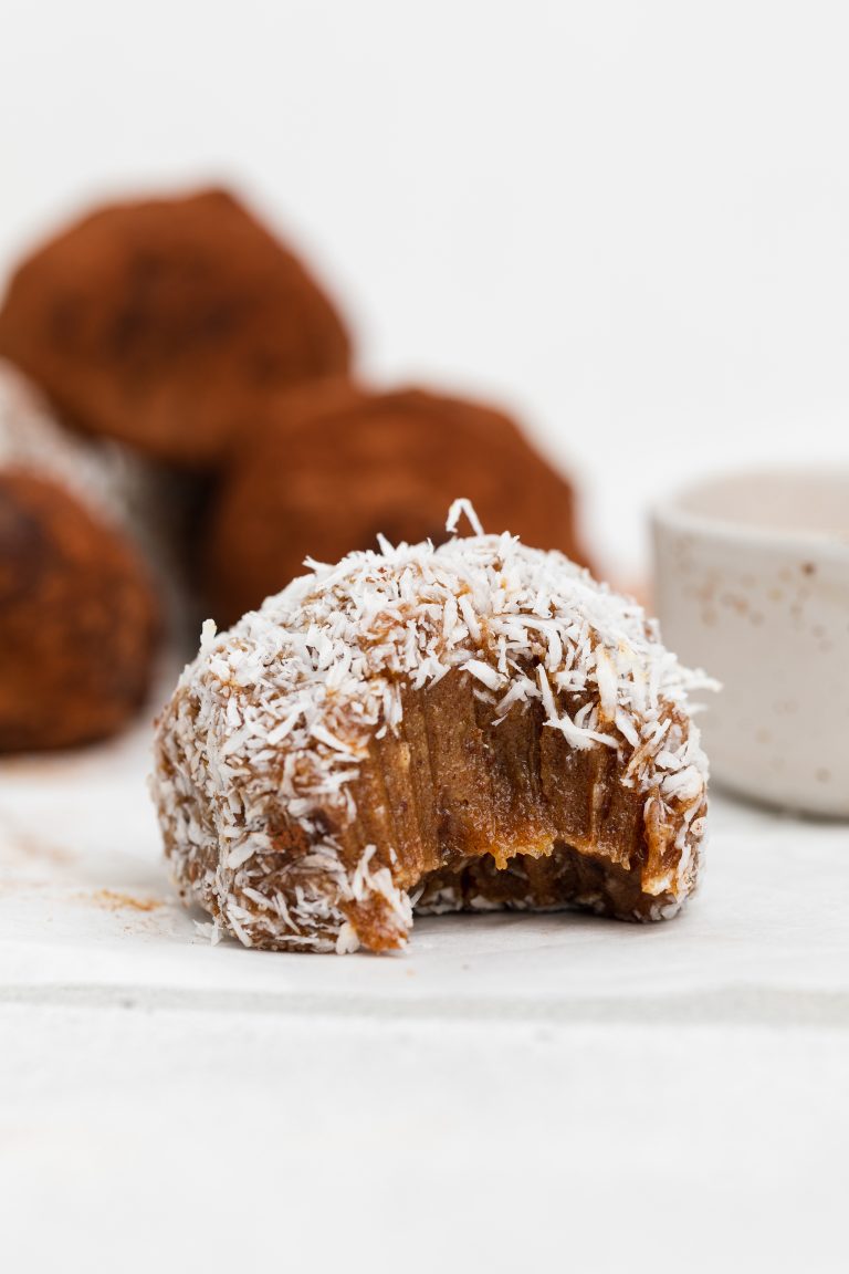 a bite taken out of salted caramel energy bites