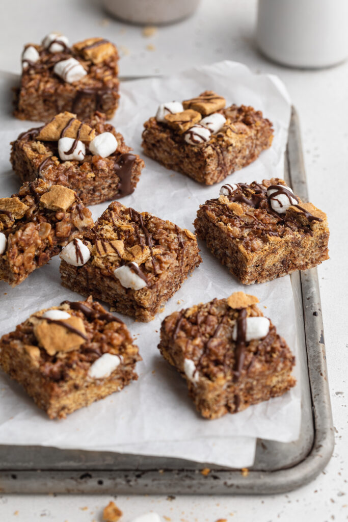 s'mores rice crispy treats spread onto an upside down baking sheet.