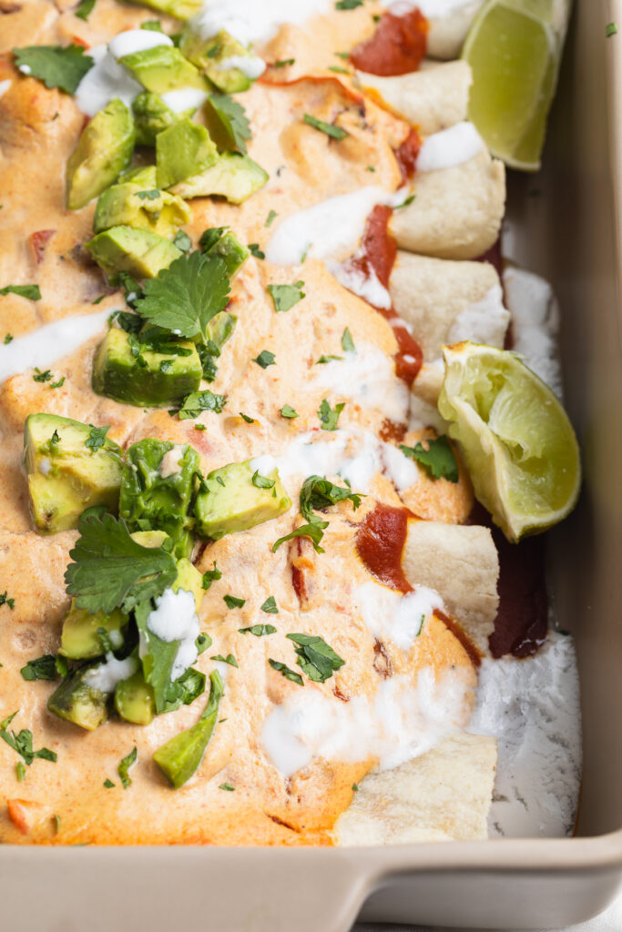close-up image of vegan enchiladas in a baking dish