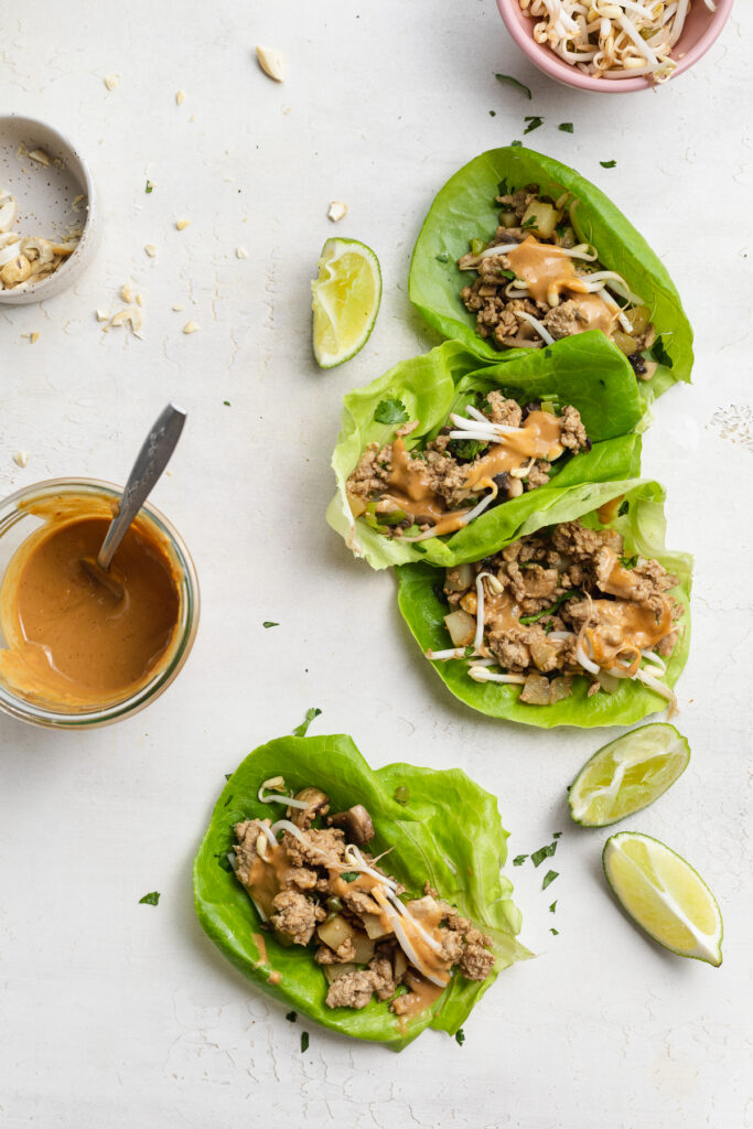 overhead image of asian turkey lettuce wraps on a table.