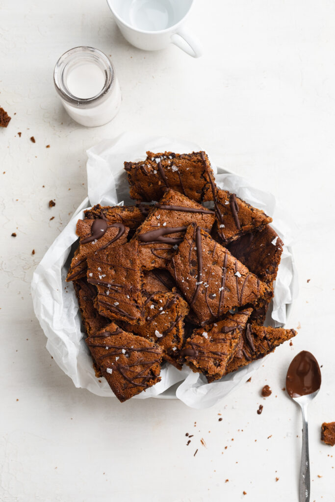 gluten-free chocolate chip cookie brittle in a bowl with milk on the side