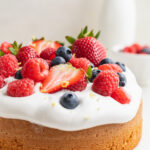 almond flour cake with fresh berries on top.