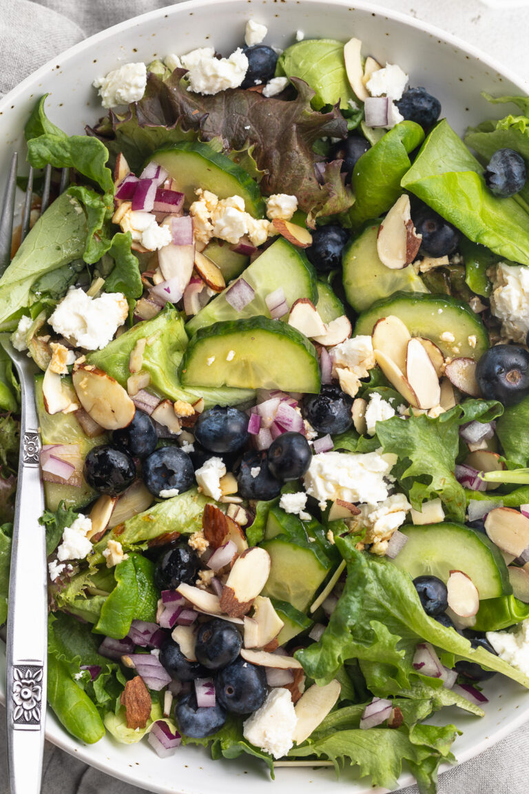 Close-up overhead image of spring mix salad in a bowl.