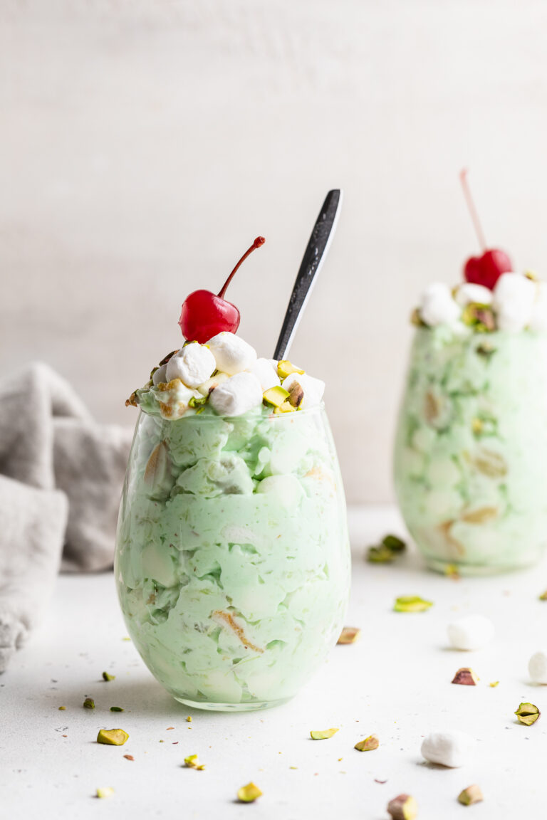 two glasses of watergate salad with cherries on top