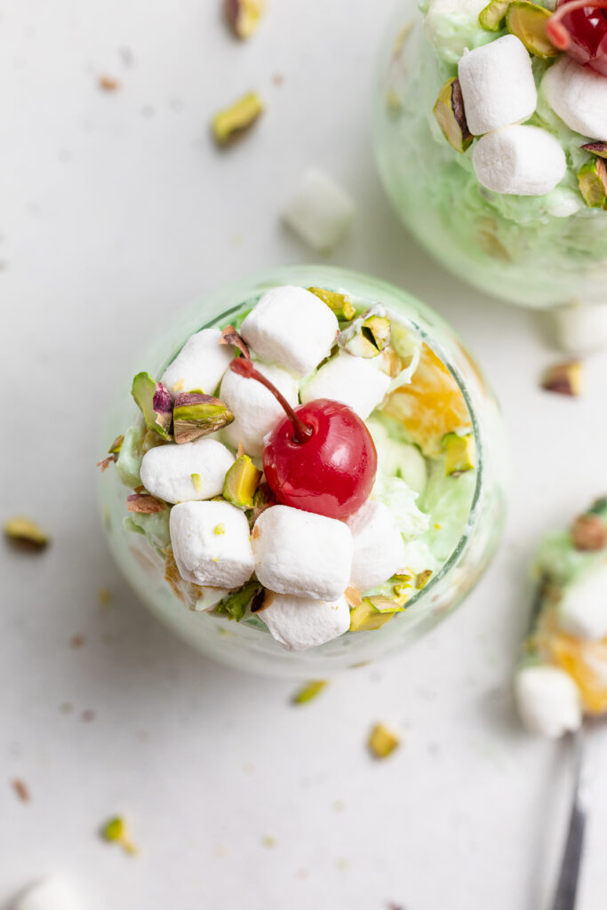 overhead image of watergate salad in a glass with a cherry on top