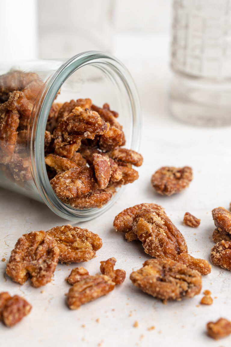 maple candied pecans tipped out of a jar