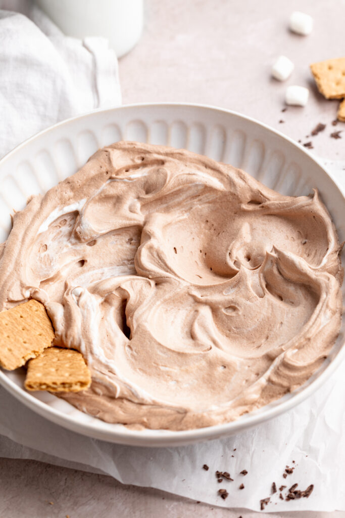 vegan hot chocolate dip in a bowl with graham crackers.