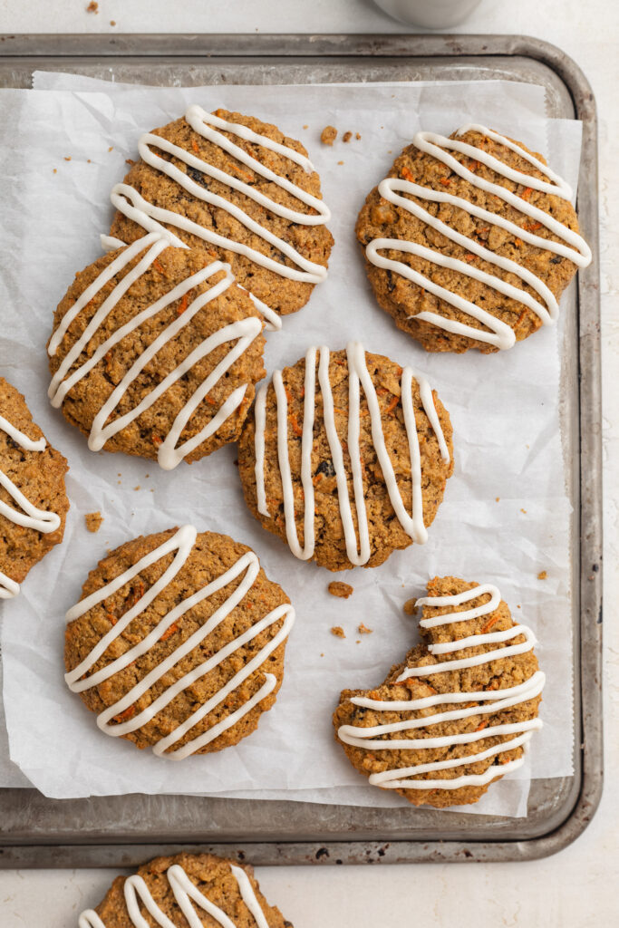 Overhead image of healthy gluten-free carrot cake cookies on a baking sheet.