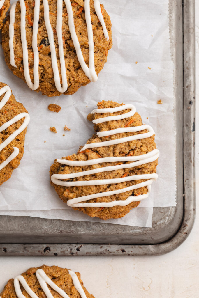 Close-up overhead image of carrot cake cookies on a baking sheet.