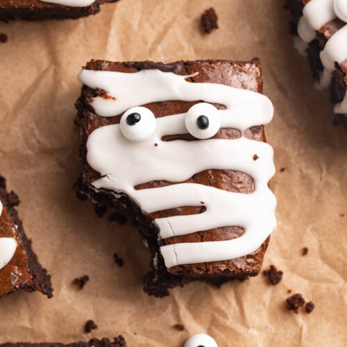 almond flour mummy brownies with a bite taken out.