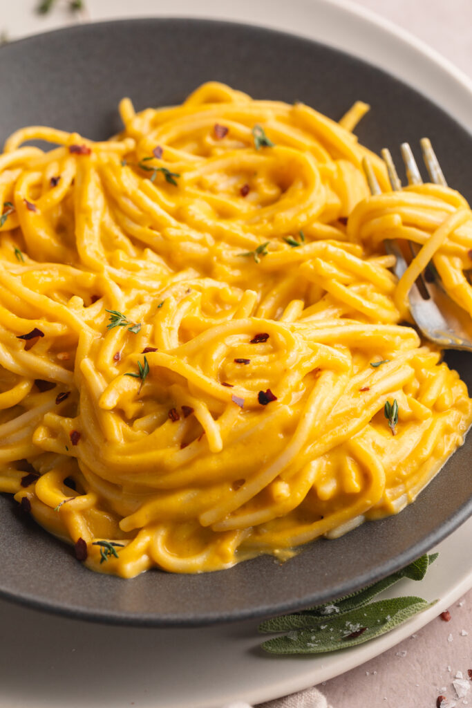 close-up image of butternut squash pasta in a bowl.