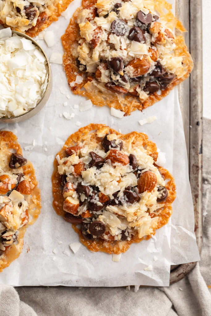 overhead image of 4 ingredient almond joy cookies on a baking sheet.