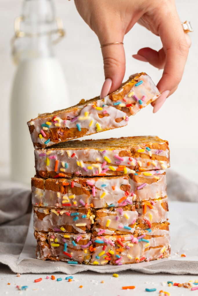 5 ingredient gluten-free birthday cake banana bread slices stacked on top of each other.