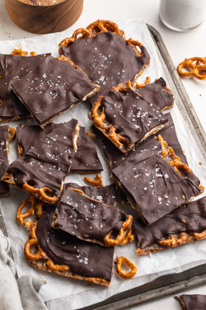 chocolate toffee pretzel bark on a baking sheet.