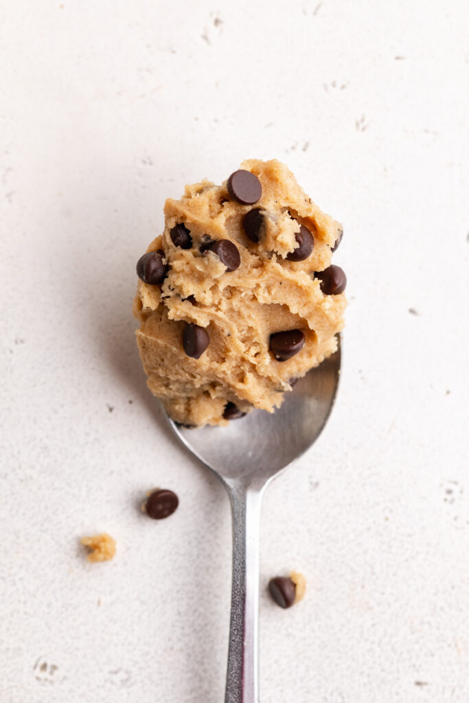 chocolate chip protein cookie dough on a spoon.