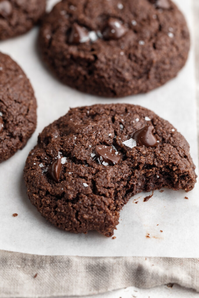 almond flour chocolate cookie with a bite taken out.