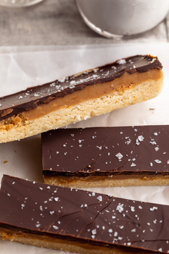 close up image of healthy twix bars with flaky salt on top.