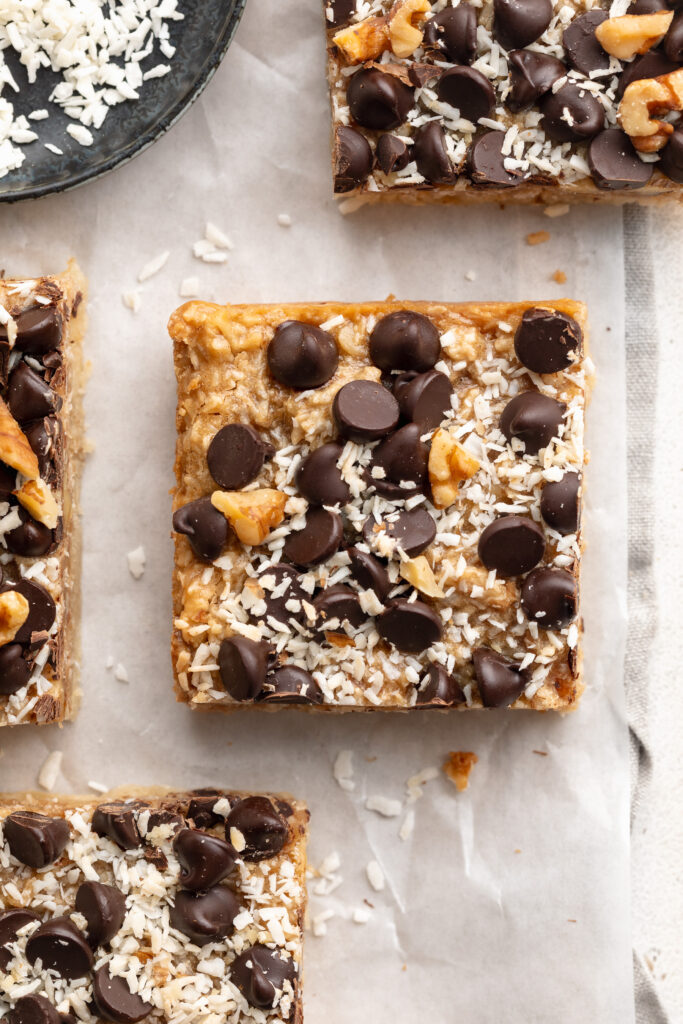 overhead image of a healthy gluten-free magic bar with chocolate chips on top.
