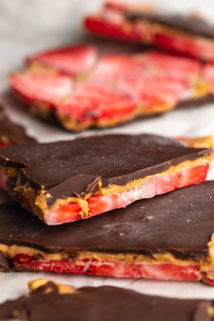 healthy strawberry peanut butter chocolate bark on parchment paper.