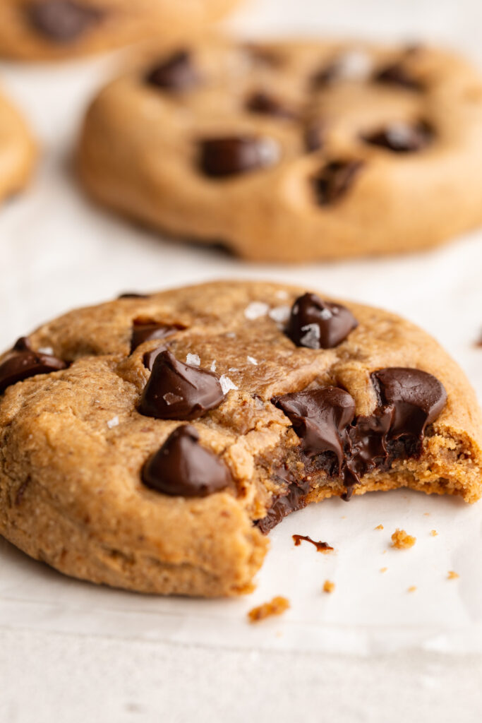 close up image of a protein cookie with a bite taken out.