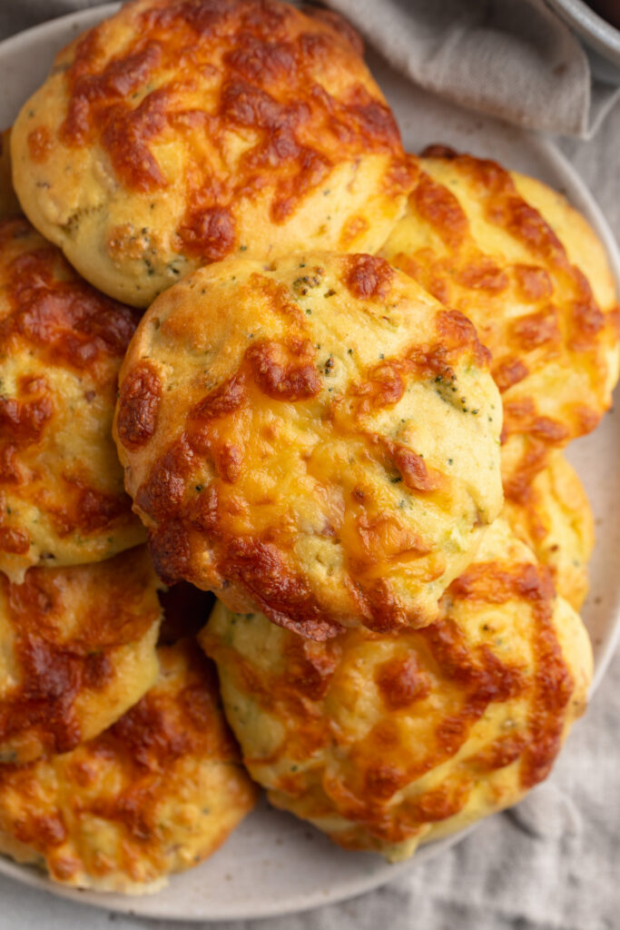 Overhead image of high-protein breakfast biscuits stacked on a plate.
