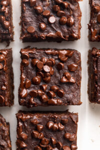 overhead image of 4 ingredient protein brownies with mini chocolate chips on top.