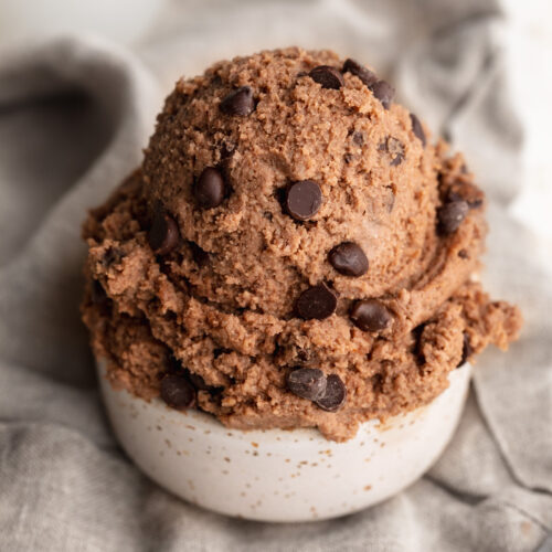 cottage cheese brownie batter scooped into a small cup.