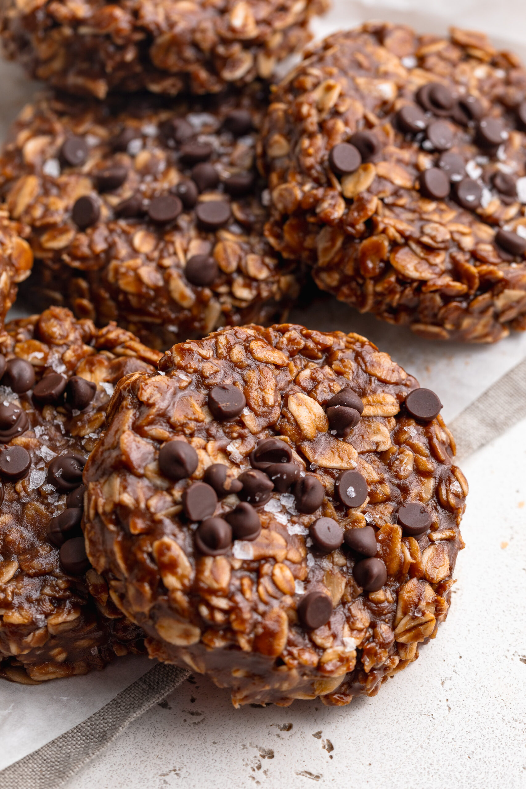 no bake cookies piled on top of each other on a table.